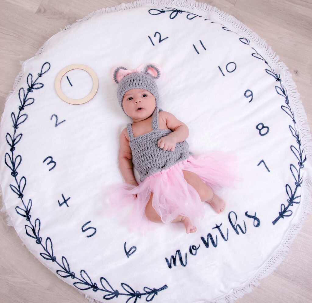 Baby on month-mat